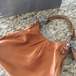 Brown leather Coach bag with silver hardware